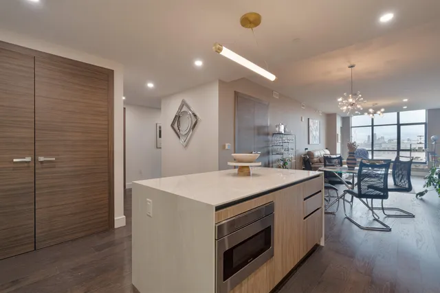 a large kitchen with a table and chairs
