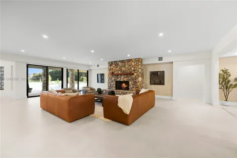 a view of a dining room with furniture and window