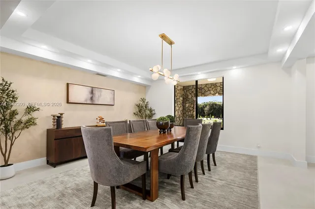 a bathroom with a tub a sink and mirror