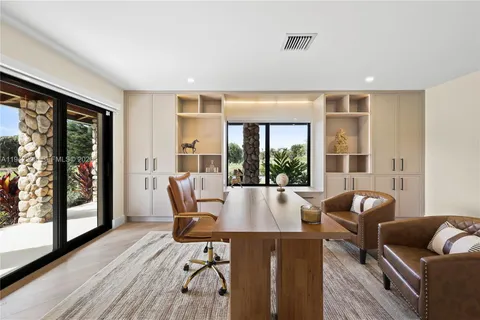 a bathroom with a granite countertop sink mirror and double