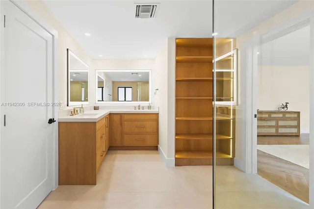 a bathroom with a shower and a sink