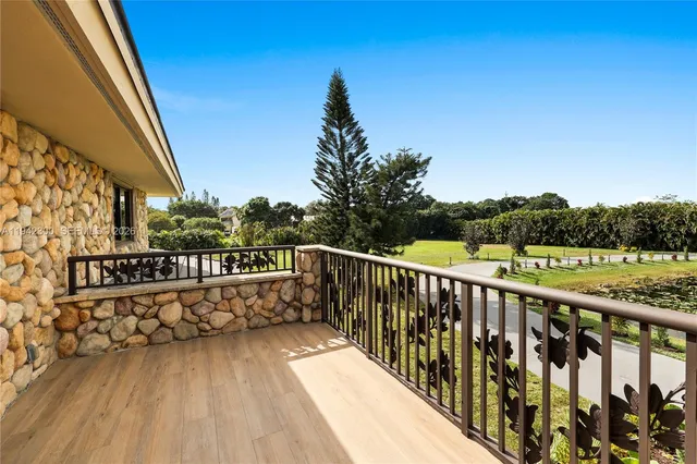 an aerial view of residential houses with outdoor space and swimming pool