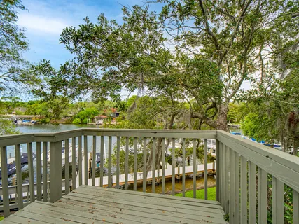 a view of balcony with wooden floor