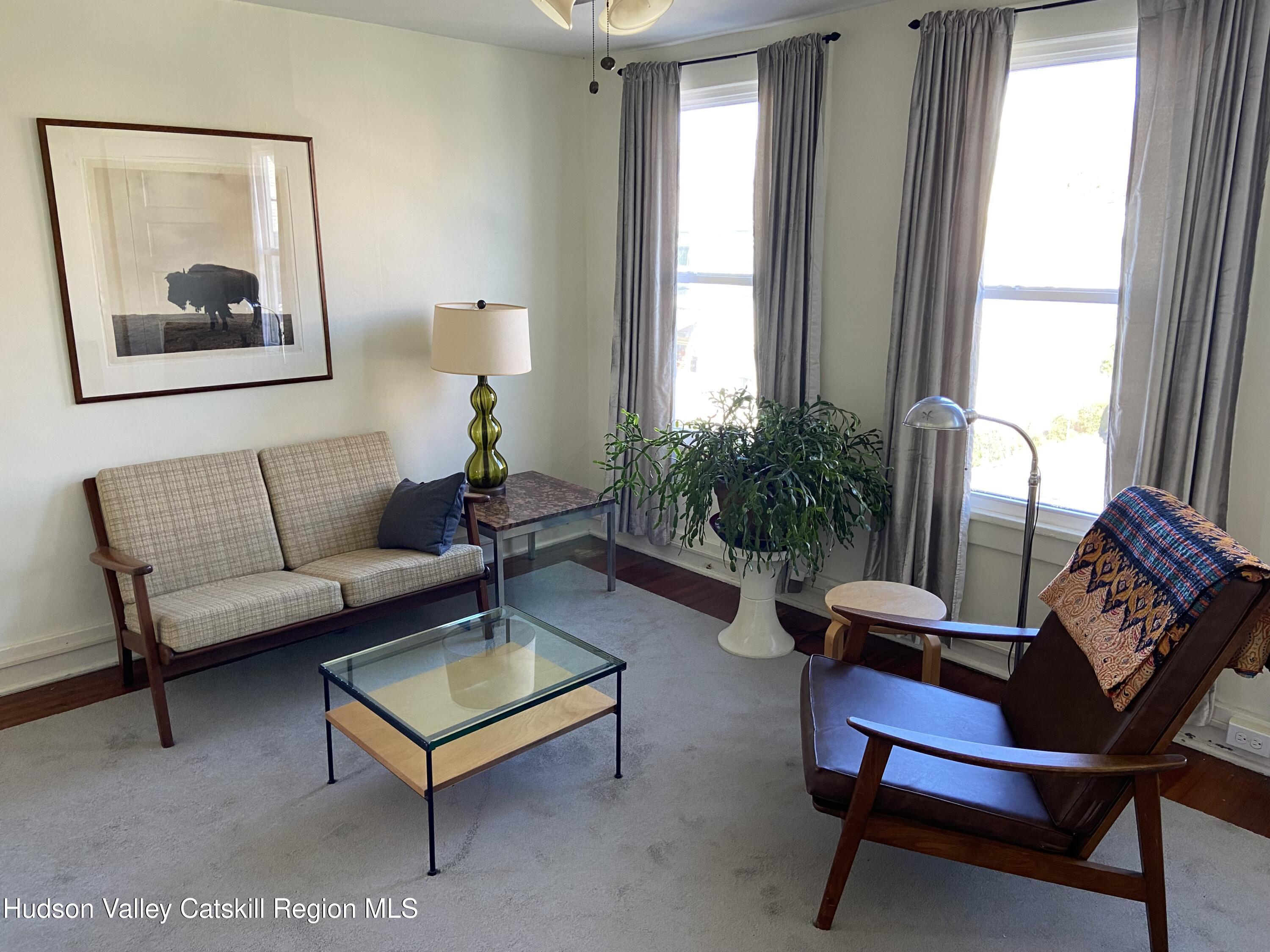 251 Robinson Street, Unit 2 Hudson, NY 12534 - Photo 1 of 7 a living room with furniture and a window