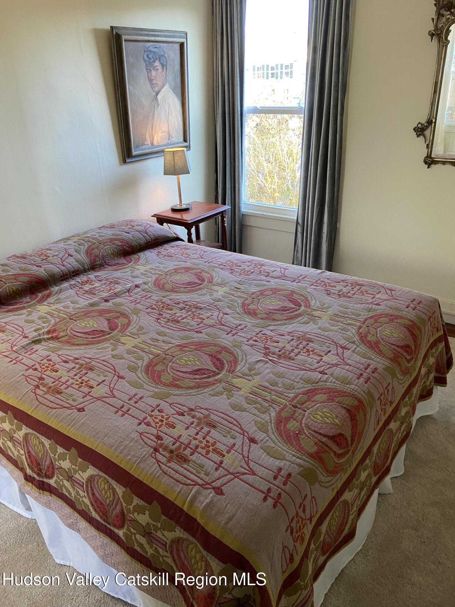 251 Robinson Street, Unit 2 Hudson, NY 12534 - Photo 4 of 7 a bedroom with a bed and a window