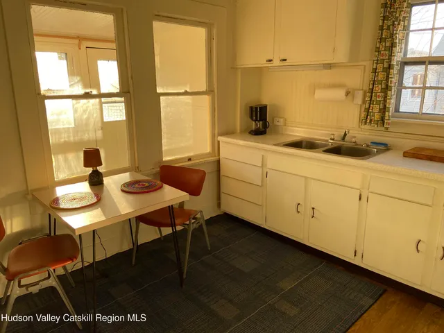 a kitchen with sink and window
