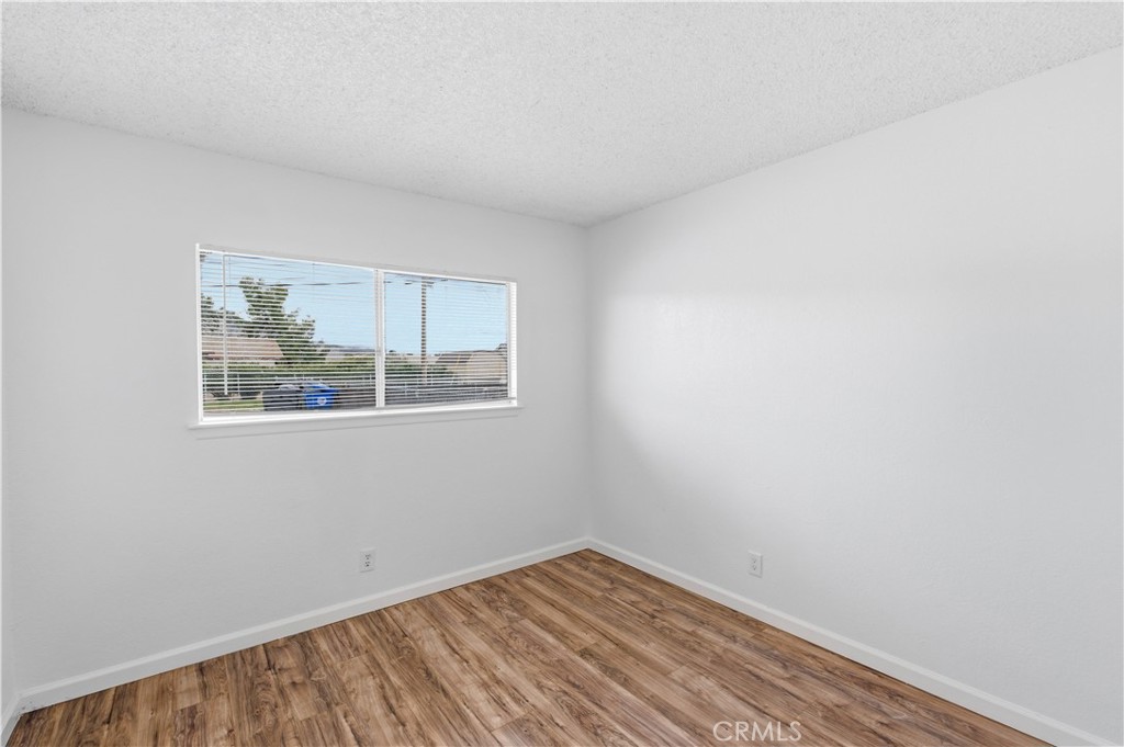 21739 Panoche Road Apple Valley, CA 92308 - Photo 13 of 49 an empty room with a window