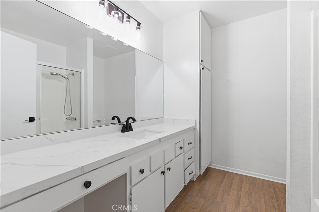 21739 Panoche Road Apple Valley, CA 92308 - Photo 16 of 49 a bathroom with a sink and mirror