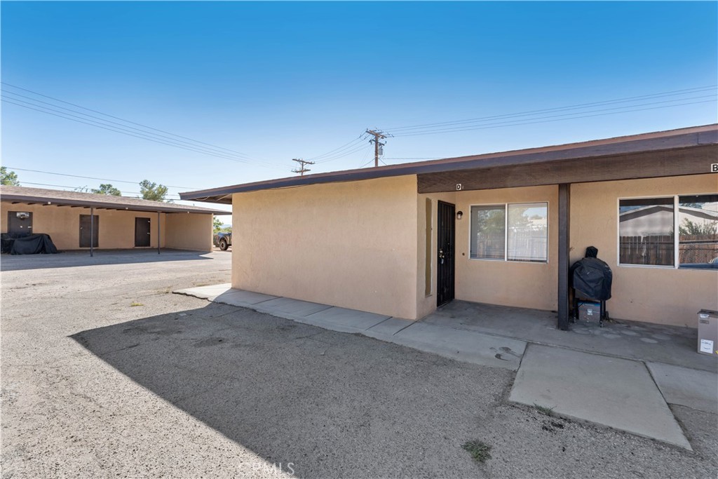 21739 Panoche Road Apple Valley, CA 92308 - Photo 21 of 49 a view of a livingroom with an empty space and a balcony