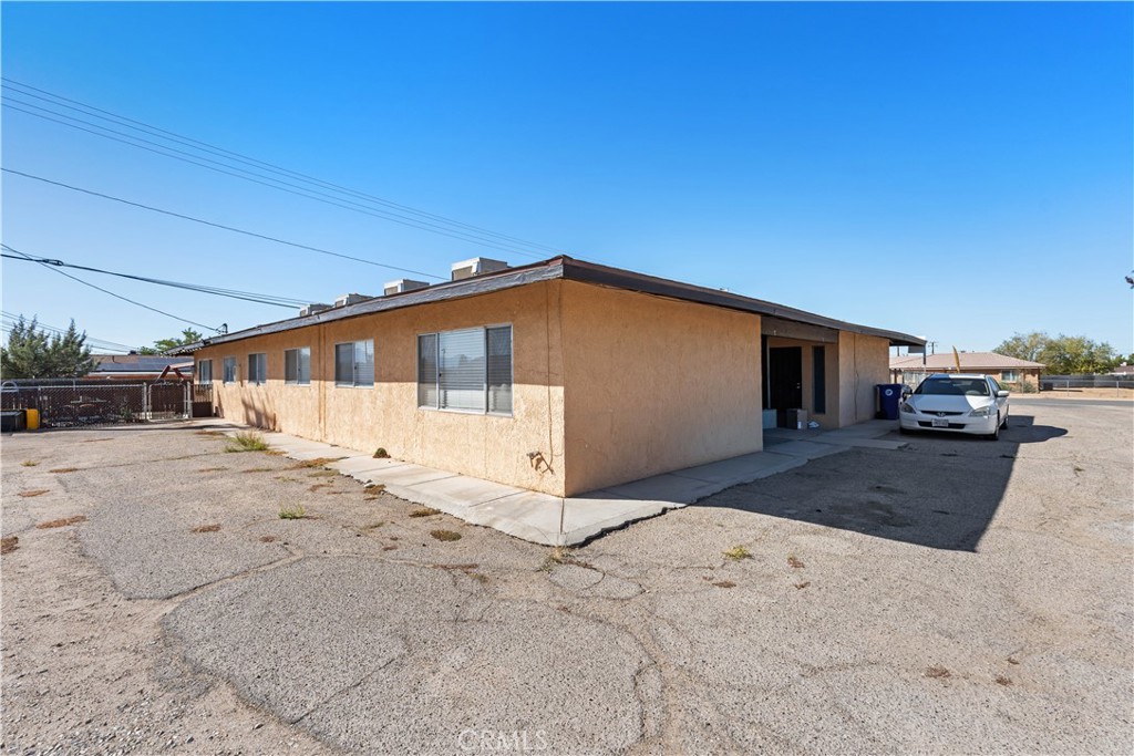 21739 Panoche Road Apple Valley, CA 92308 - Photo 23 of 49 a view of a house with backyard