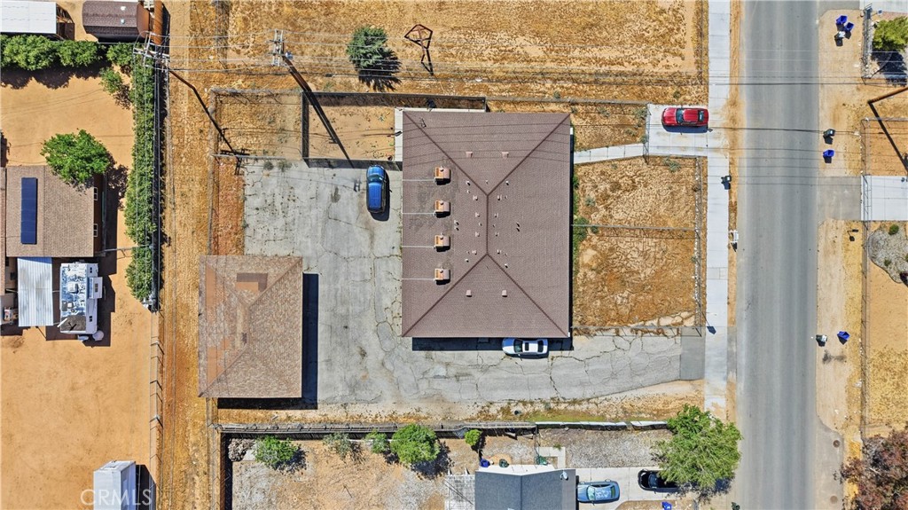 21739 Panoche Road Apple Valley, CA 92308 - Photo 38 of 49 an aerial view of a house with a yard and large trees