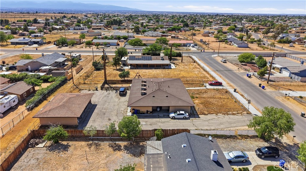21739 Panoche Road Apple Valley, CA 92308 - Photo 44 of 49 an aerial view of residential houses with outdoor space