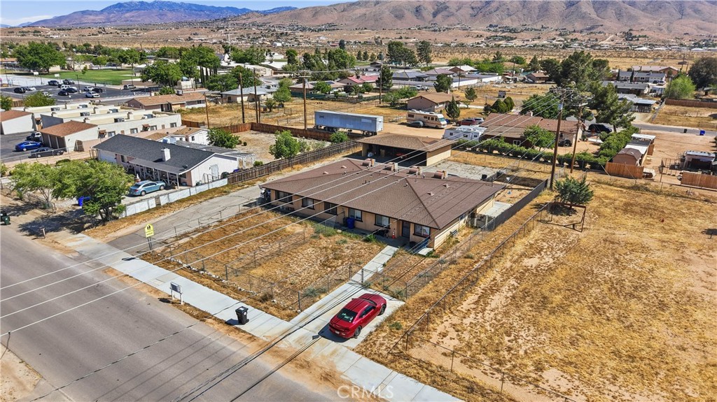21739 Panoche Road Apple Valley, CA 92308 - Photo 47 of 49 an aerial view of residential houses with outdoor space