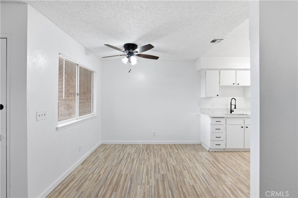21739 Panoche Road Apple Valley, CA 92308 - Photo 8 of 49 a view of a kitchen with marble kitchen and sink