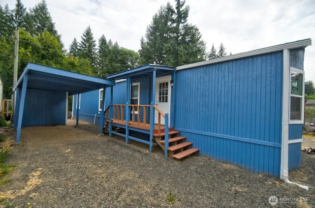 a view of backyard with deck and backyard