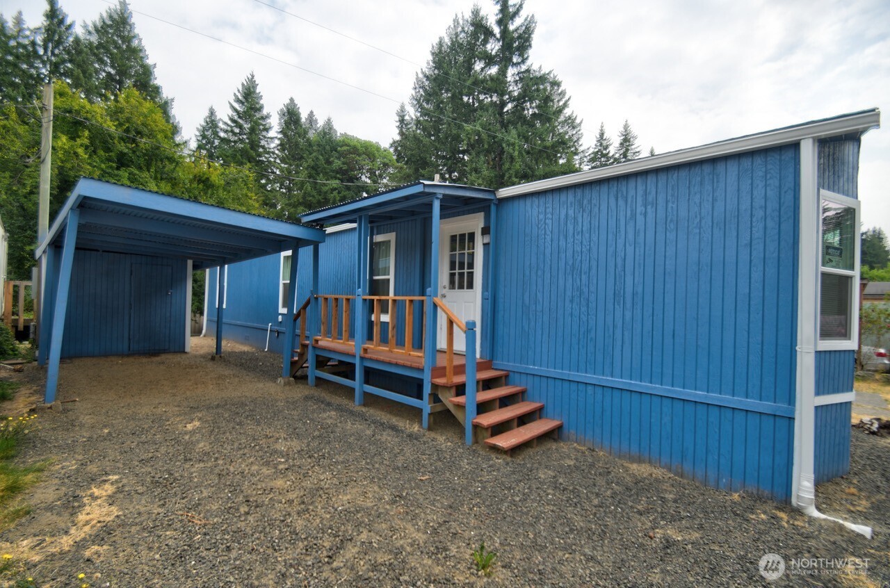 a view of backyard with deck and backyard