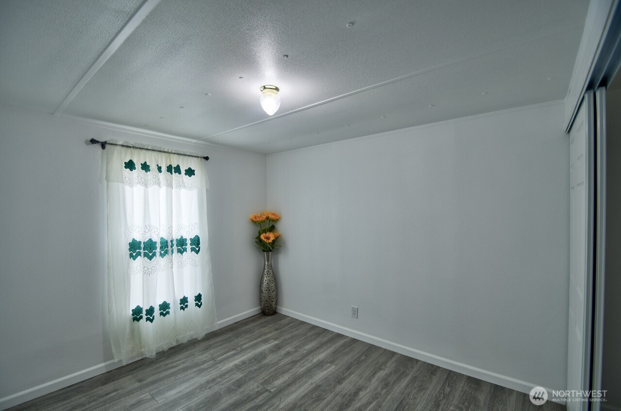 2115 Rocky Point Road Northwest, Unit 22 Bremerton, WA 98312 - Photo 11 of 16 an empty room with windows