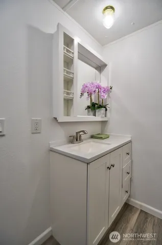 a bathroom with a sink and a mirror