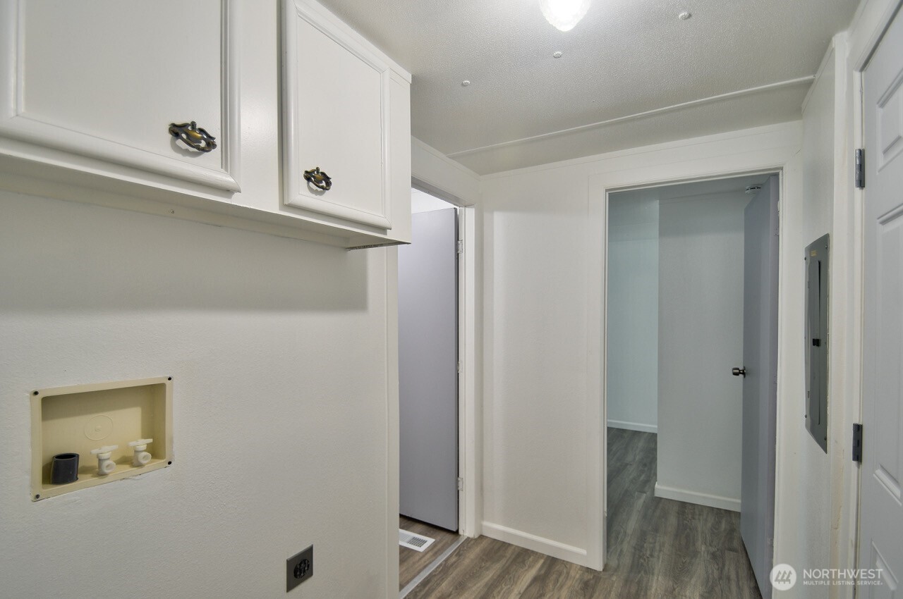 2115 Rocky Point Road Northwest, Unit 22 Bremerton, WA 98312 - Photo 14 of 16 a bathroom with a sink and mirror