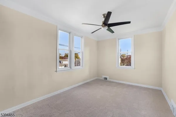 a view of empty room with windows