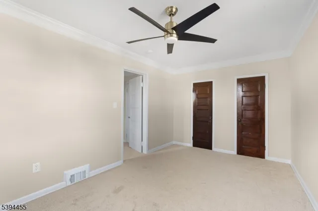 a view of a livingroom with a ceiling fan