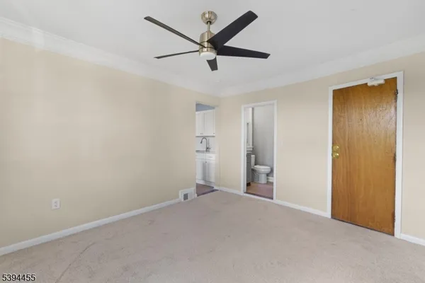 a view of a livingroom with a ceiling fan