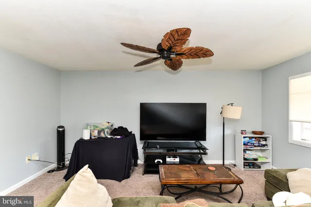 a kitchen with stainless steel appliances granite countertop a stove a sink dishwasher a refrigerator and cabinets with wooden floor