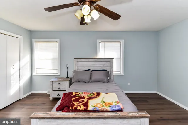 a bathroom with a sink a toilet and a window