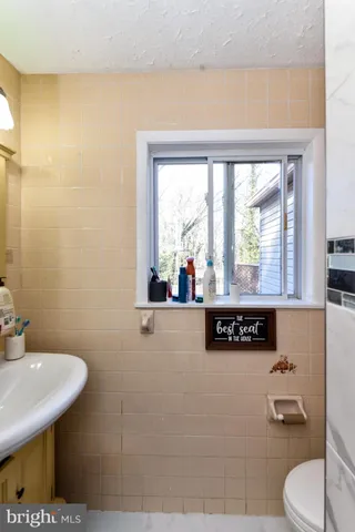 a bedroom with furniture and a flat screen tv