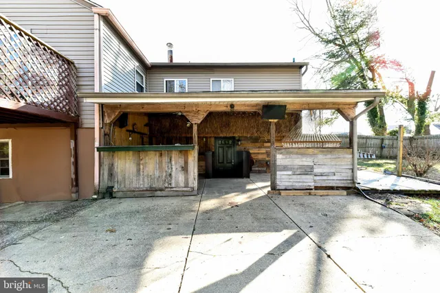 a backyard of a house with lots of trees