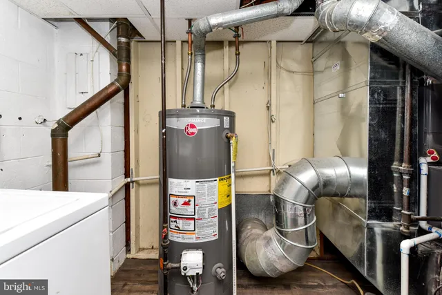 a view of a backyard with wooden fence
