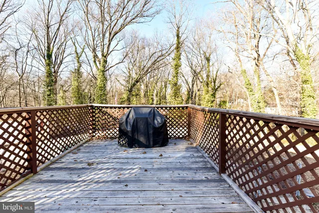 a view of a house with a yard covered with snow in the background