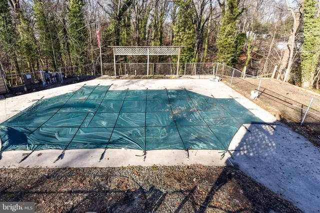 a view of a white house with a yard