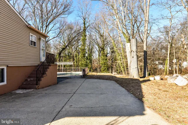 a view of a house with snow on the road