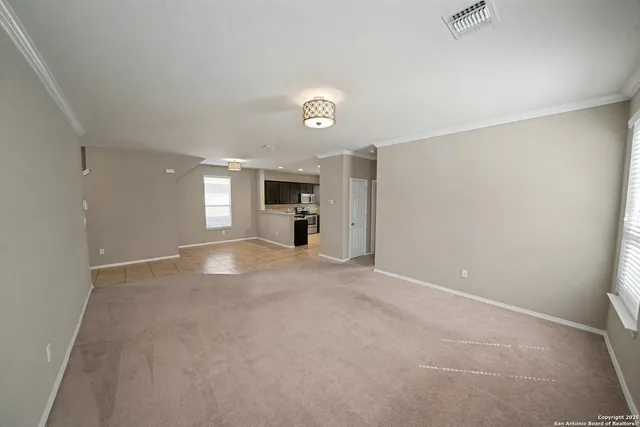 a kitchen with stainless steel appliances granite countertop a refrigerator sink and microwave