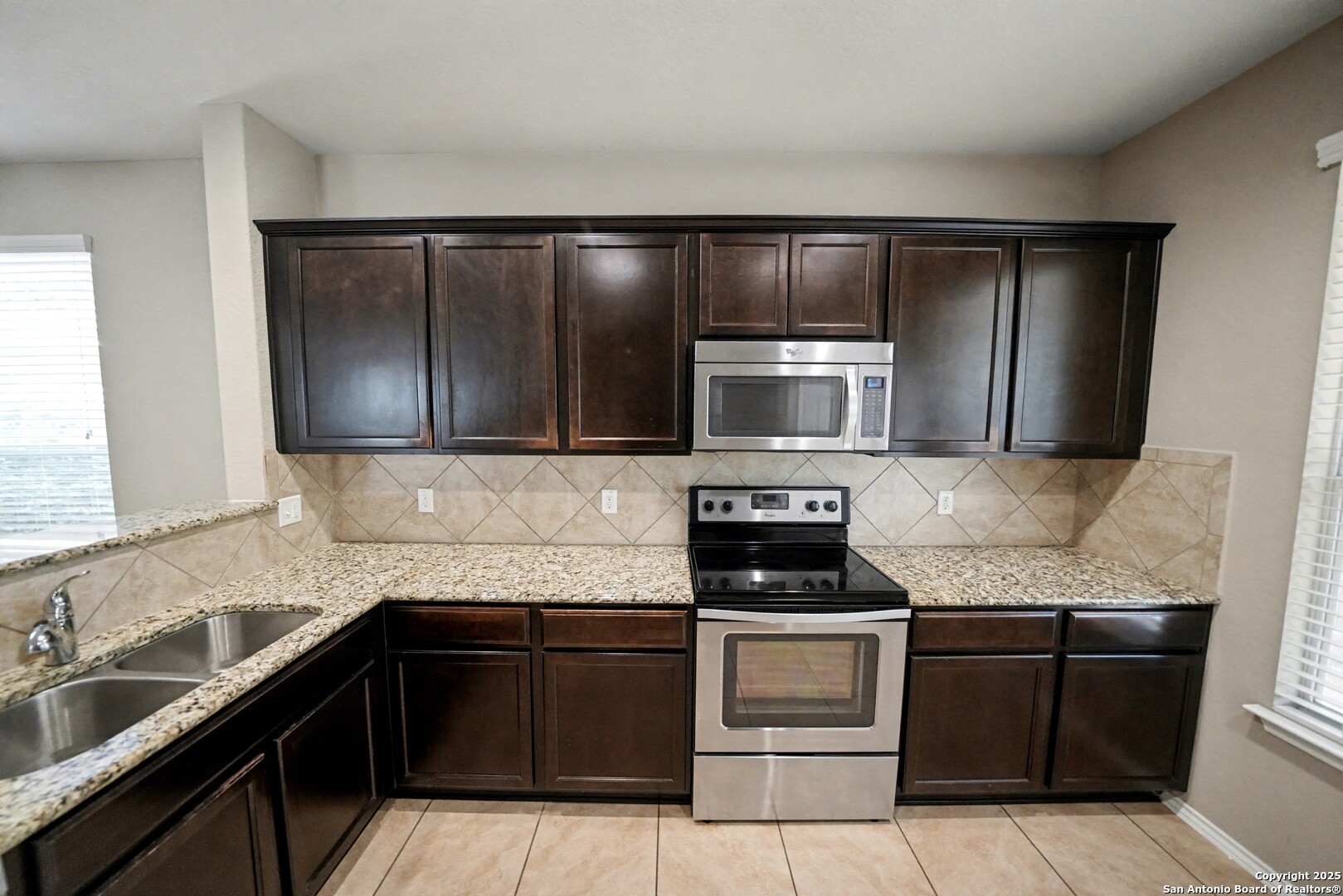 478 Walnut Crest Schertz, TX 78154 - Photo 16 of 47 a kitchen with granite countertop stainless steel appliances and cabinets