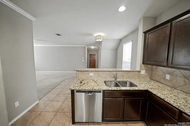 a kitchen with a refrigerator and a sink