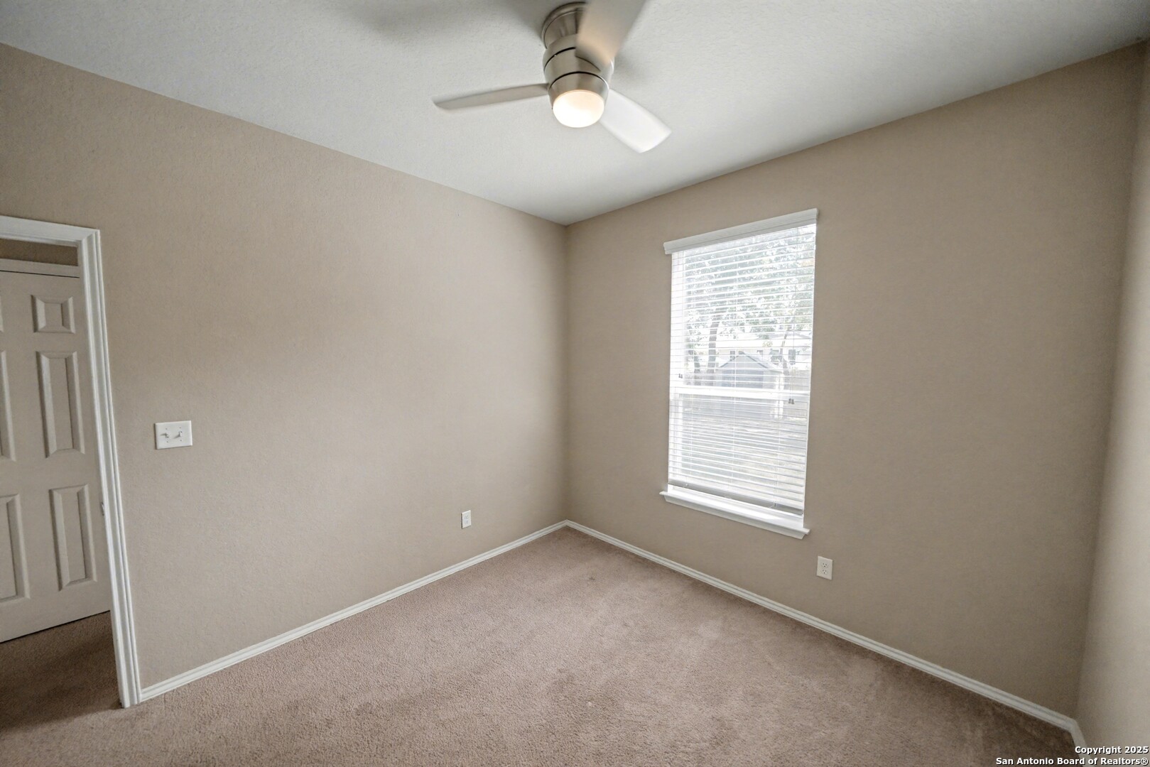 478 Walnut Crest Schertz, TX 78154 - Photo 20 of 47 an empty room with a window and ceiling fan