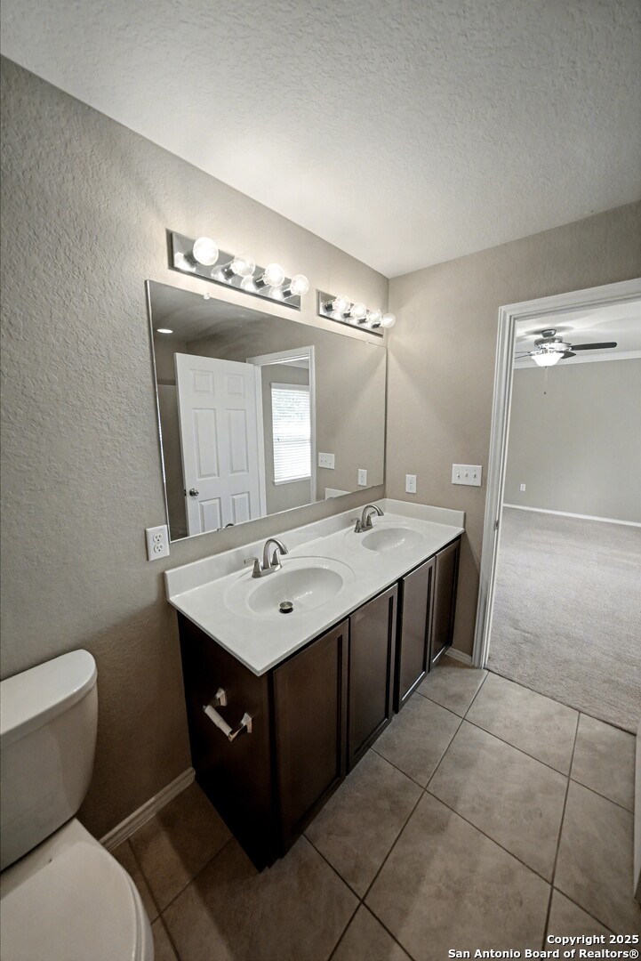 478 Walnut Crest Schertz, TX 78154 - Photo 26 of 47 a bathroom with a toilet sink and mirror