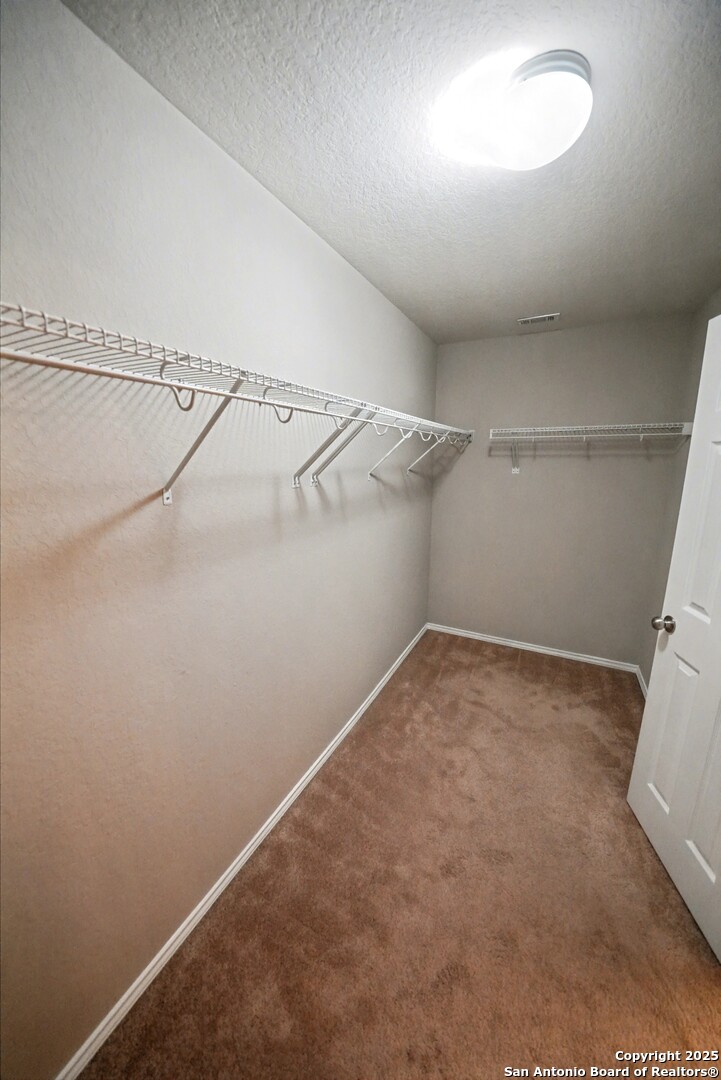 478 Walnut Crest Schertz, TX 78154 - Photo 28 of 47 a view of a room with racks on the wall