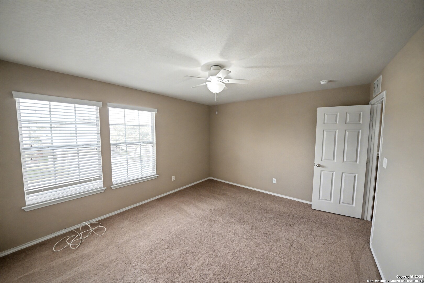 478 Walnut Crest Schertz, TX 78154 - Photo 34 of 47 an empty room with chandelier fan and windows