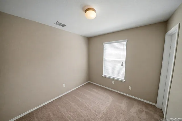 a view of a room with a window