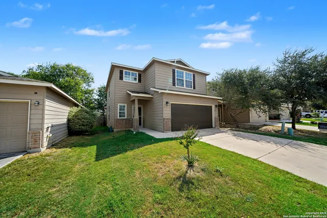 a house view with a garden space