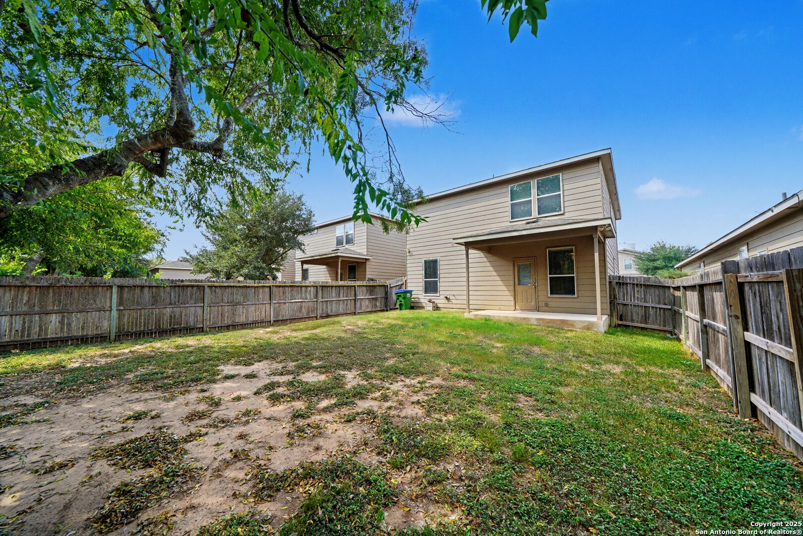 478 Walnut Crest Schertz, TX 78154 - Photo 45 of 47 a view of a backyard with potted plants and wooden fence