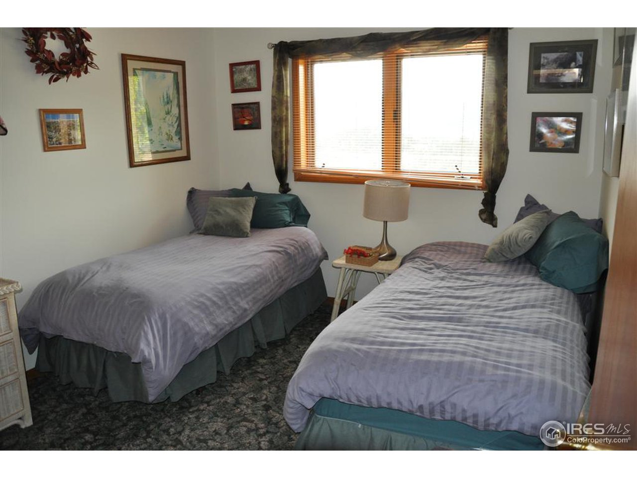 440 Venner Ranch Road Estes Park, CO 80517 - Photo 12 of 25 a bedroom with two beds and a window