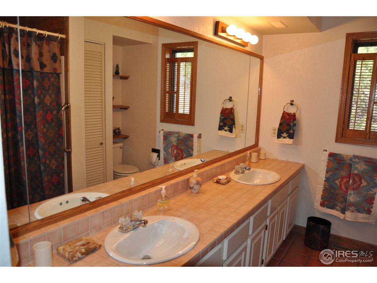 440 Venner Ranch Road Estes Park, CO 80517 - Photo 13 of 25 a bathroom with a sink double vanity and a mirror