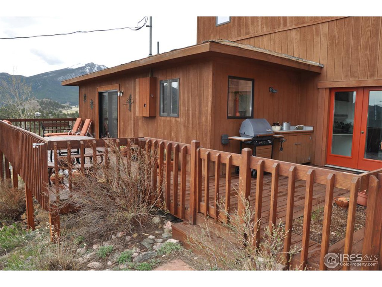 440 Venner Ranch Road Estes Park, CO 80517 - Photo 19 of 25 a front view of a house with wooden fence