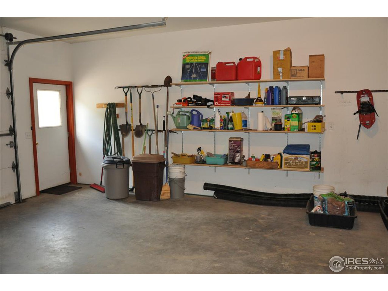 440 Venner Ranch Road Estes Park, CO 80517 - Photo 24 of 25 a living room with lots of furniture and clutter