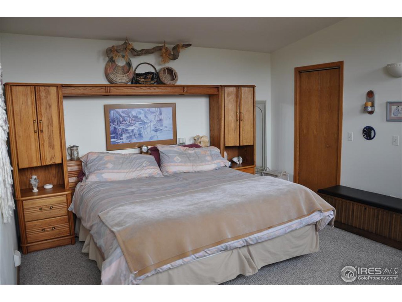 440 Venner Ranch Road Estes Park, CO 80517 - Photo 8 of 25 a bedroom with a bed and wooden floor