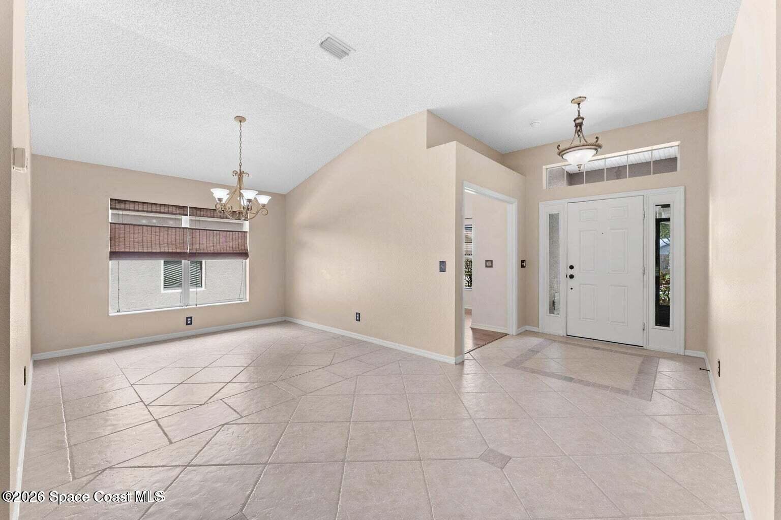 4741 Decatur Circle Melbourne, FL 32934 - Photo 5 of 44 a view of an empty room with a window